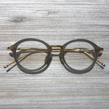 トムブラウン(THOM BROWNE)の通常使用感のあるグレイゴールドの度入り眼鏡を買取致しました。エコスタイル新宿三丁目です。状態は通常使用感のあるお品物です。